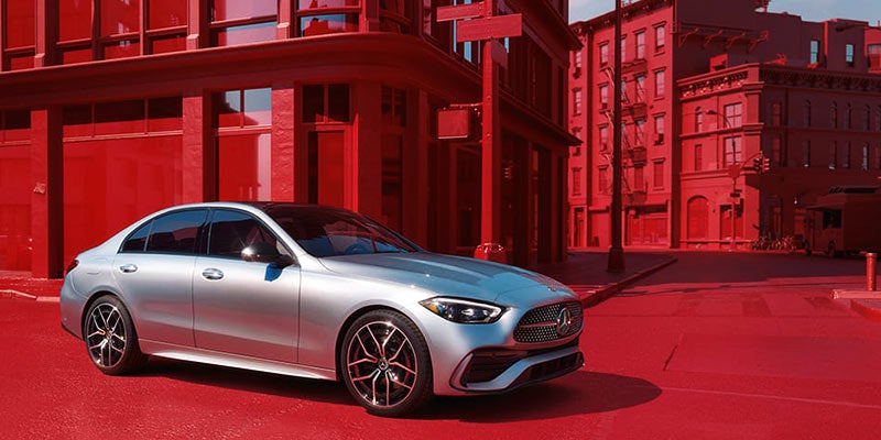 Silver Mercedes-Benz sedan parked on a city street, shown from the front-left angle
